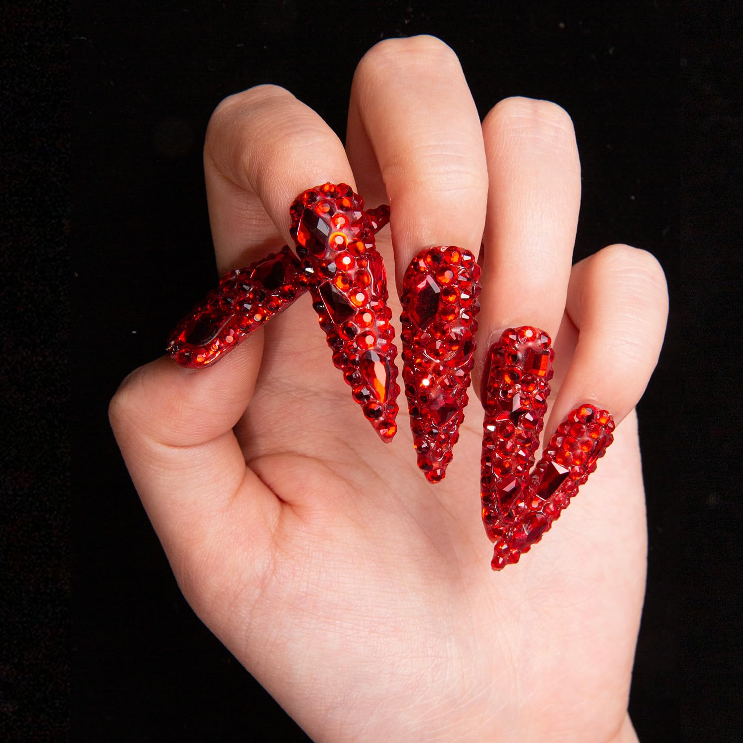 LOVFUL full-covered crystals nails catch light for a statement manicure.