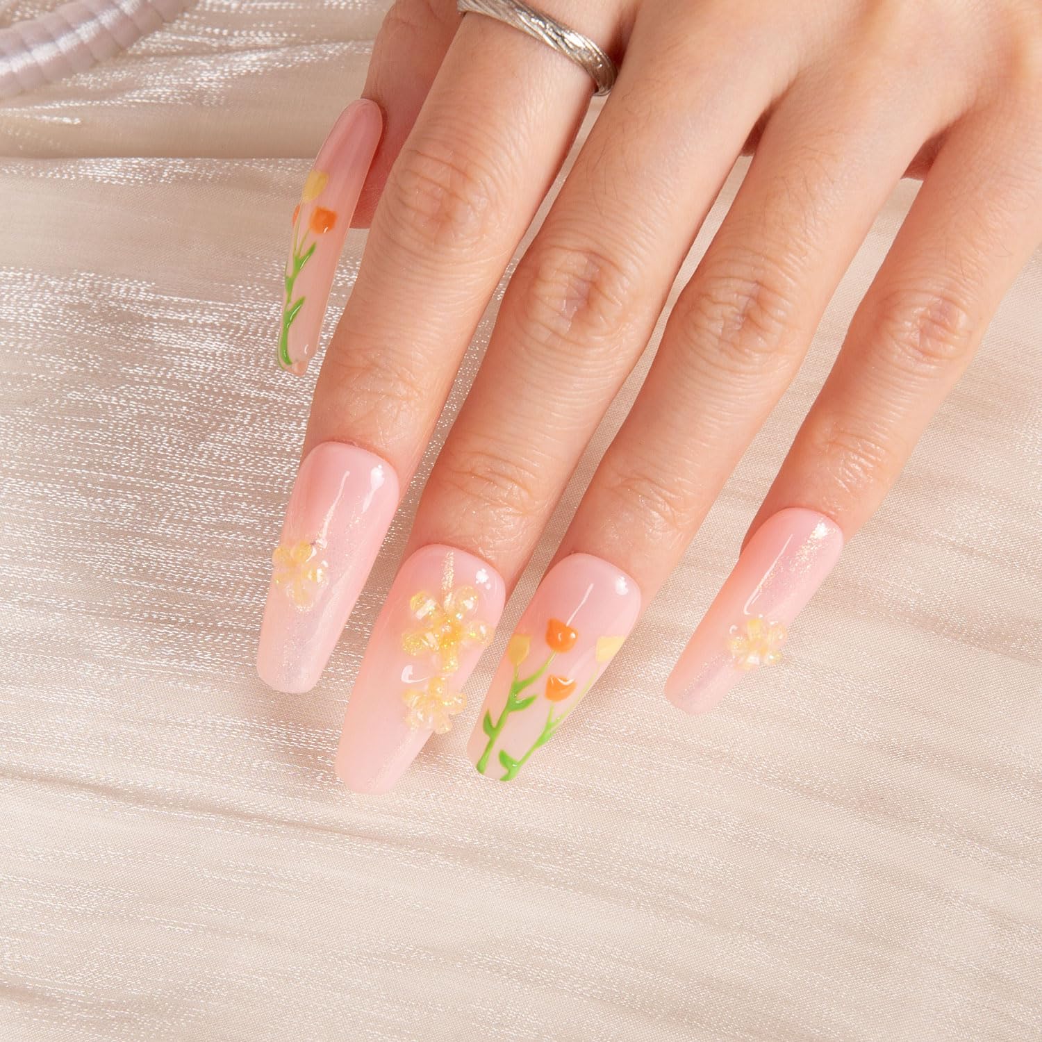 Reusable coffin classic nails offer long wear with an elegant crystal accent.
