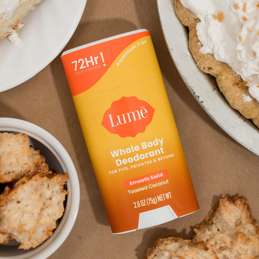 Lume products displayed on clean bathroom shelf.