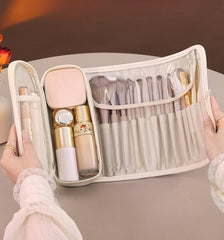 Luxury leather makeup brush case with brush slots protects tools on the go.