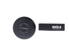Open compact showing translucent powder that sets makeup without color change.