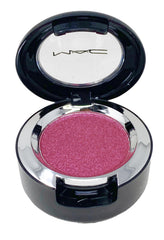 MAC Dazzleshadow Extreme Celebutante swatch on eyelid with molten rosy pink and red sparkle.