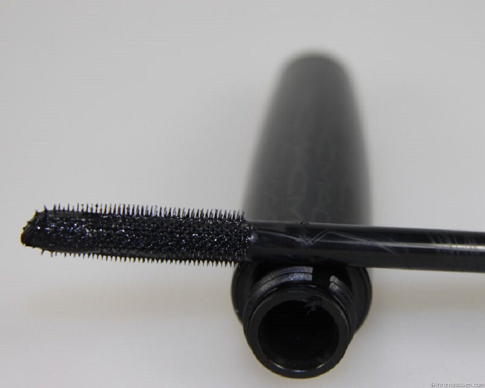 Close-up of MAC mascara brush for dramatic lash definition.