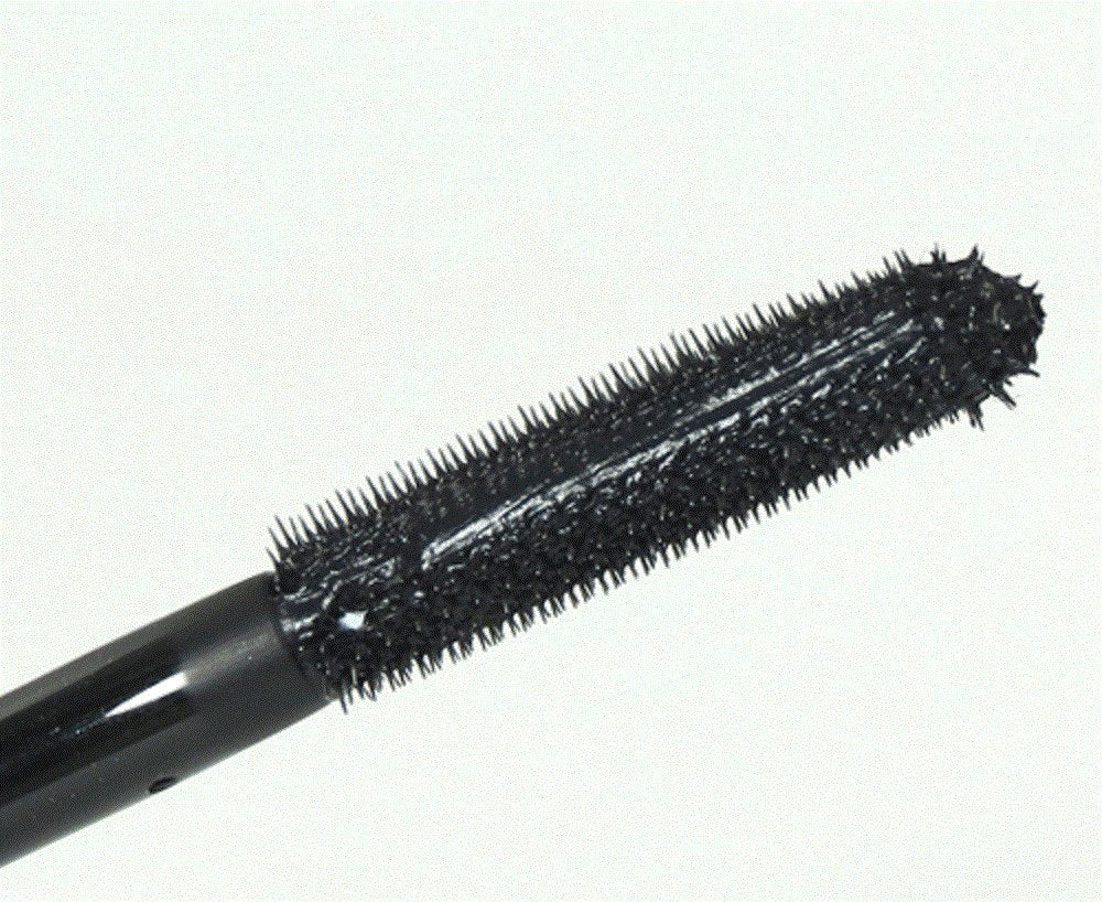 MAC mascara wand in action delivering enhanced volume and lift.