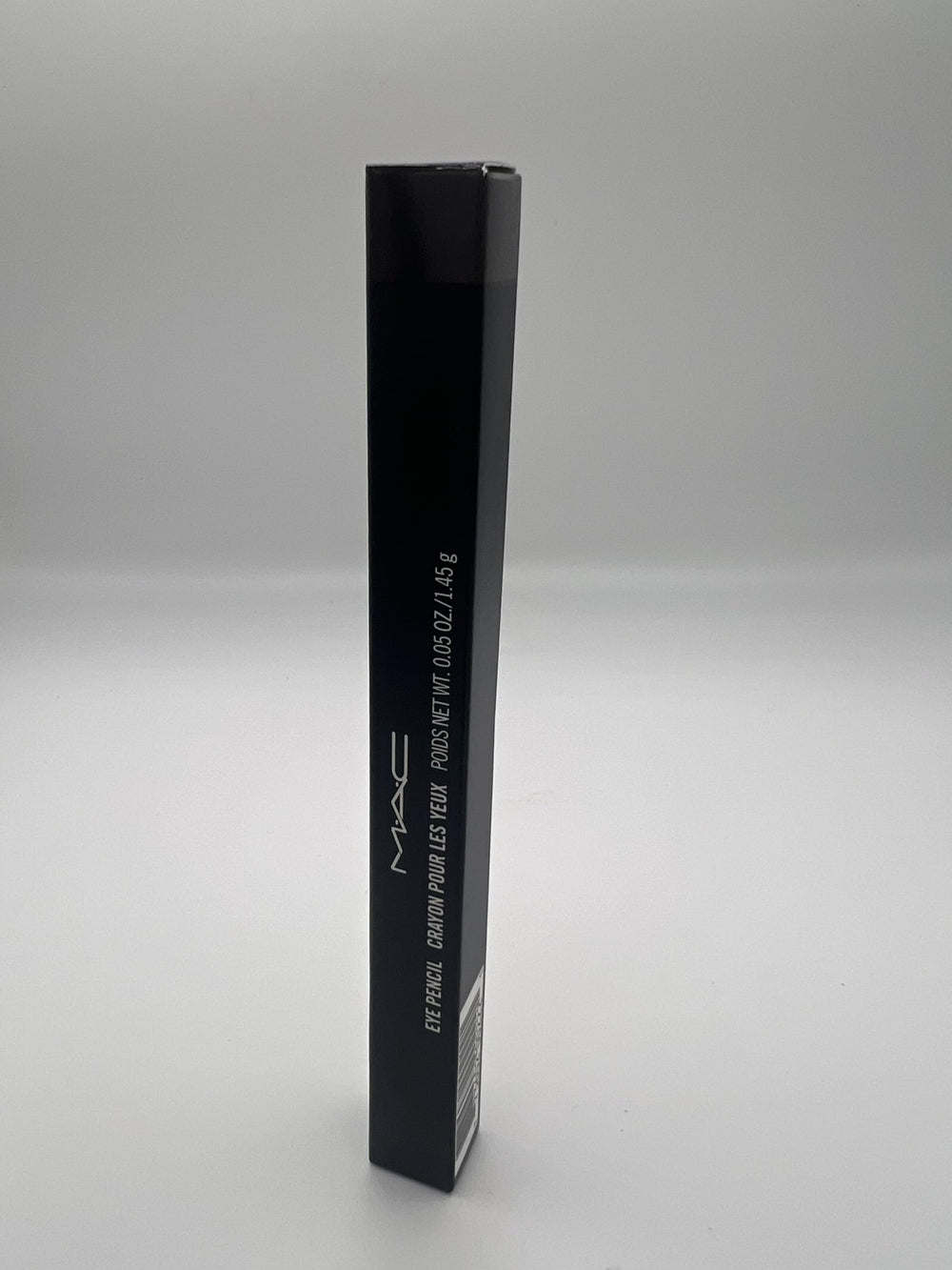 MAC Eye Pencil Coffee application on lid demonstrates warm brown shade for definition.