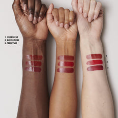 MAC Mini Lustreglass Ruby Rouge — glossy red lip finish for a luminous look.