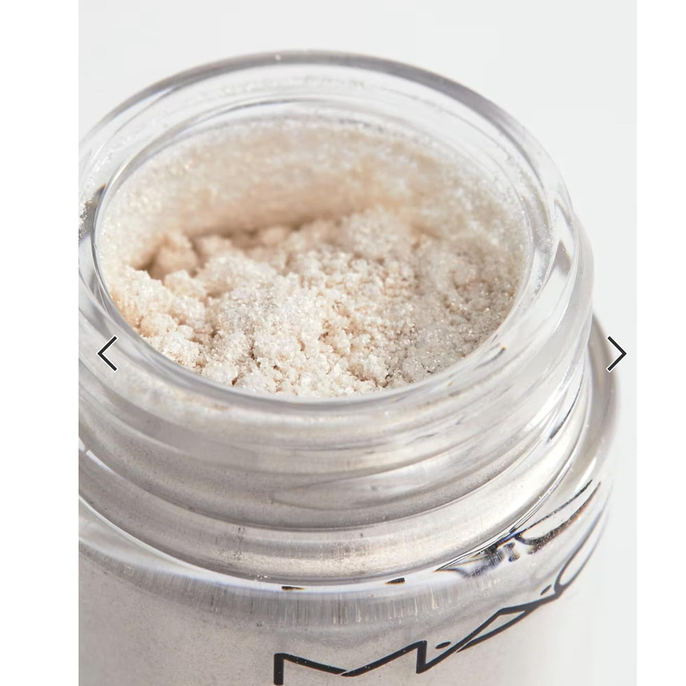 Close-up texture of MAC Pigment Vanilla highlights fine shimmer and blendable powder.