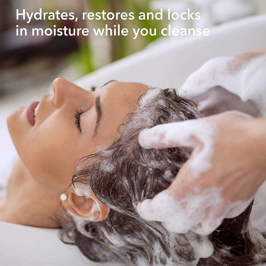 Macadamia Professional shampoo lather showing rich cleansing for textured hair.