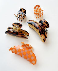 MACHETE Heirloom clip styled with a ponytail for a chic office look.