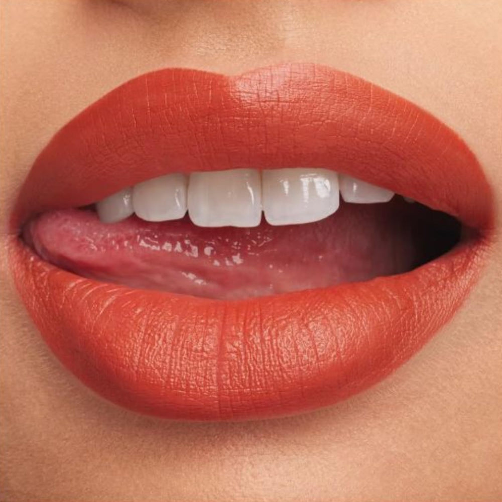 MAC Lipstick application showcases full-coverage color and lip conditioning