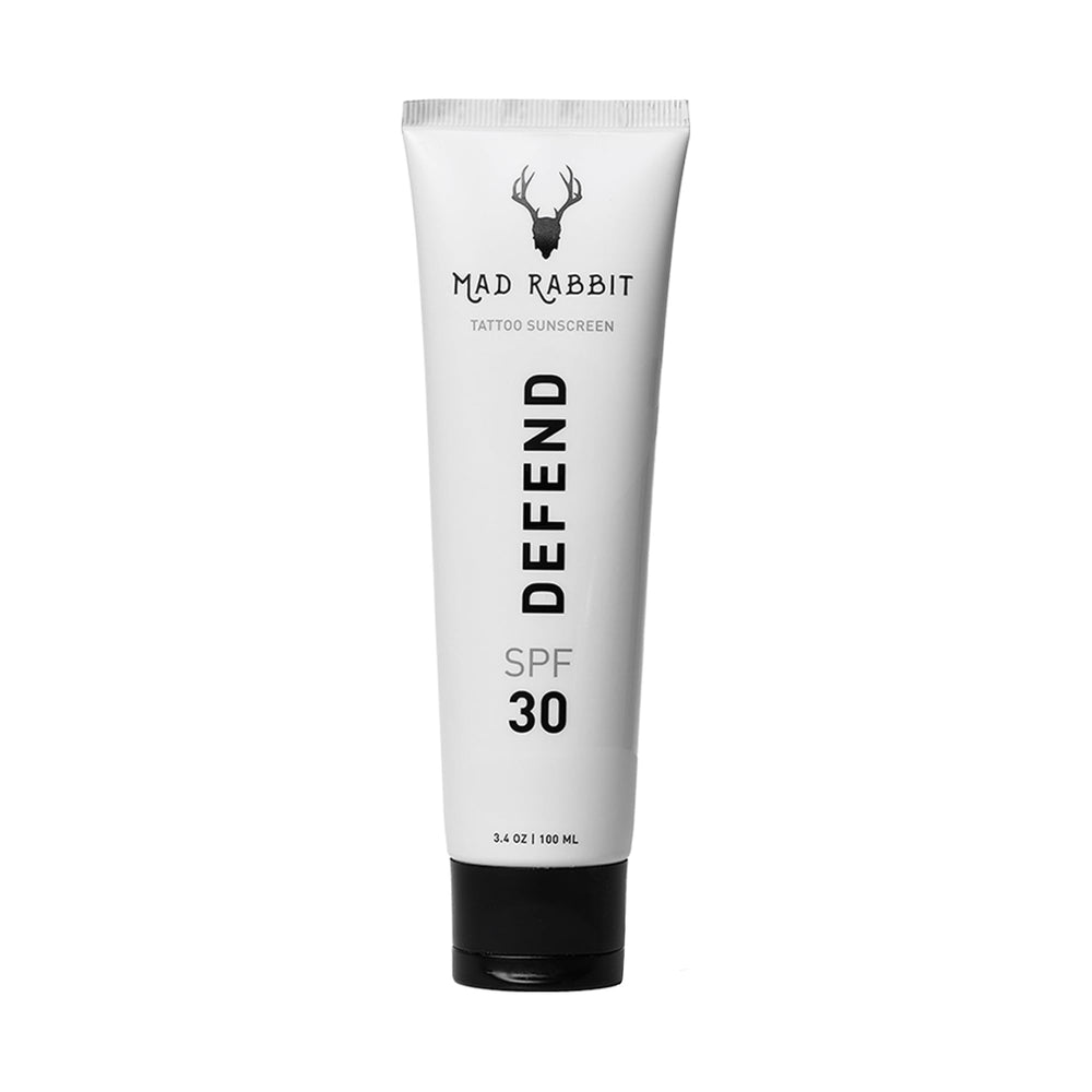 Mad Rabbit Defend SPF 30 mineral sunscreen tube front view protecting tattoos.