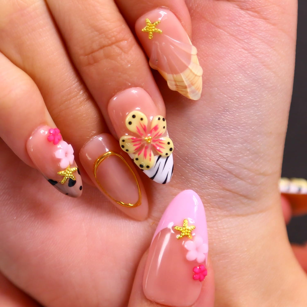 MAGLFELL floral and diamonds nail art with textured, handmade design.
