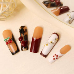 Maigitur butterfly charm nails adding whimsy to any outfit