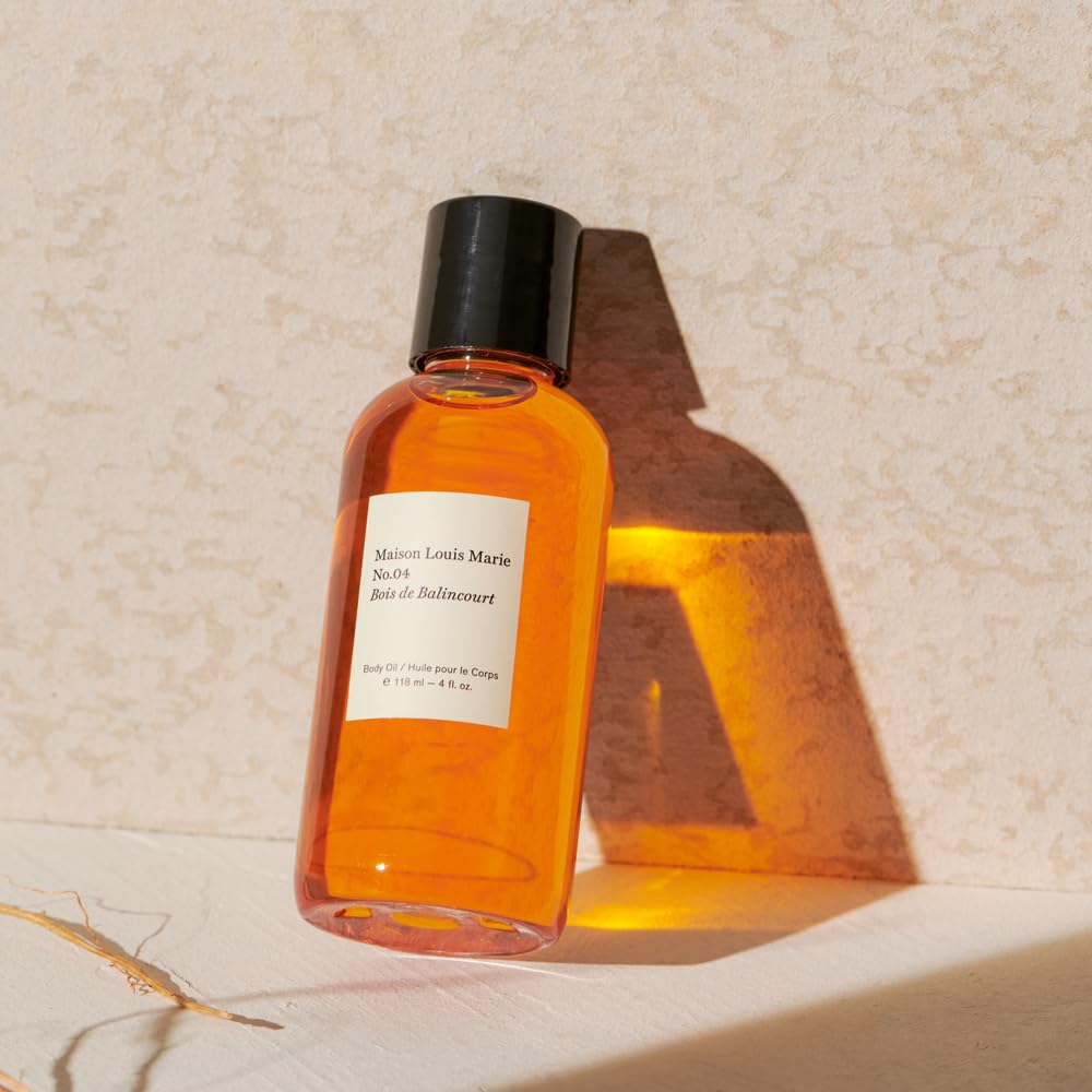 Maison Louis Marie No.04 bottle beside towel for daily self-care ritual.