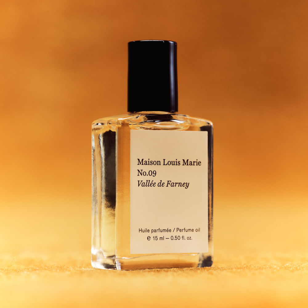 Maison Louis Marie No.09 label detail shows scent notes and brand.