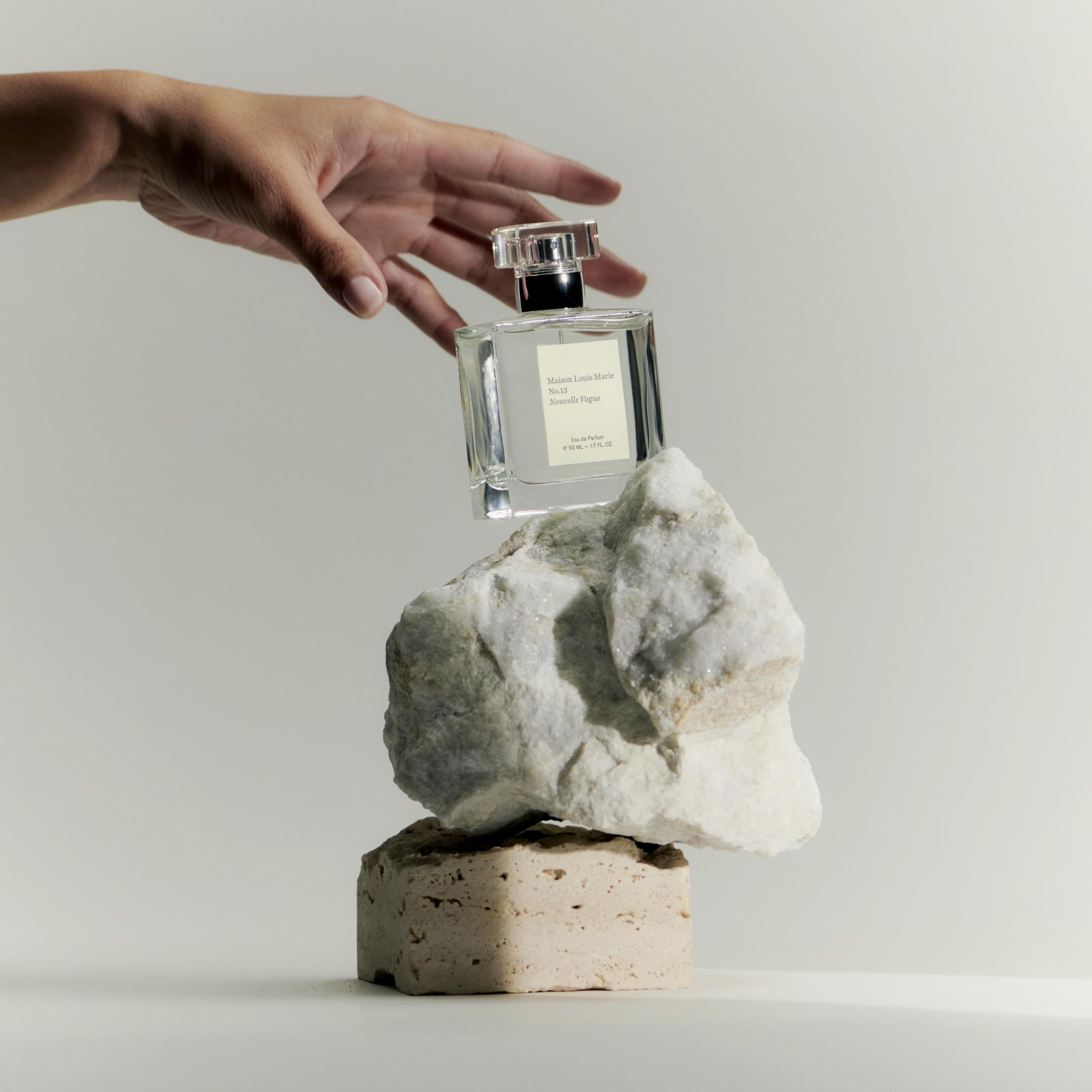 Maison Louis Marie No.13 Nouvelle Vague bottle tilt captures soft light.