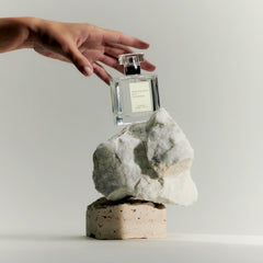 Maison Louis Marie No.13 Nouvelle Vague bottle tilt captures soft light.