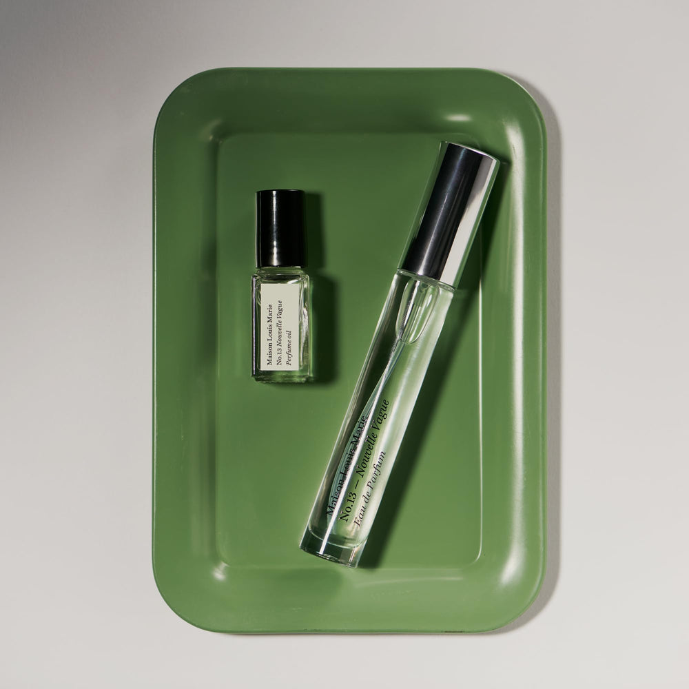 No.13 Nouvelle Vague mini roll-on oil image emphasizes compact size for discreet application.
