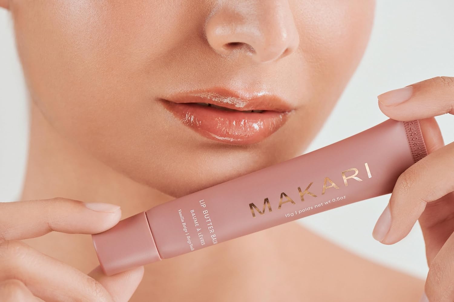 Makari Vanilla Beige lip balm on makeup bag display.
