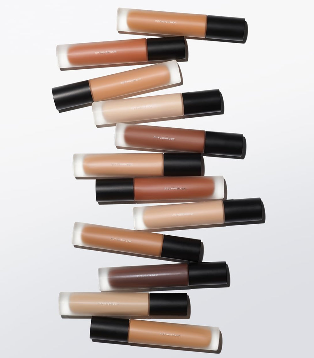Applying MAKE Diffusion Dew Skin Tint with fingers for seamless blend.