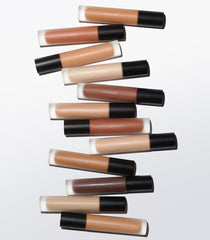 Applying MAKE Diffusion Dew Skin Tint with fingers for seamless blend.