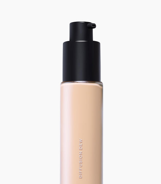 MAKE Beauty Diffusion Dew Skin Tint swatch on arm shows buildable glow.