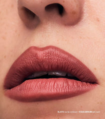 Blending brush beside MAKE Lip Continuum slate for seamless blending