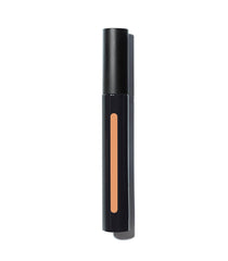 MAKE Beauty Skin Mimetic Concealer close-up over spots demonstrates buildable coverage.