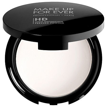 Make Up For Ever HD Microfinish pressed powder texture close-up, soft-focus blur for skin.