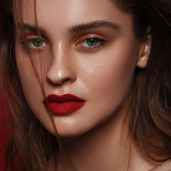 Close-up of MAKI YIKA lipstick being applied smoothly.
