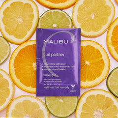 Malibu C Curl Partner Wellness Remedy crystals dissolving on damp hair for detox