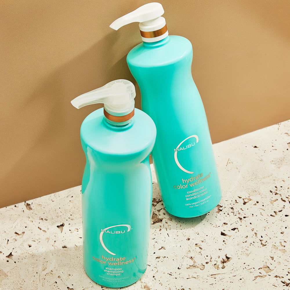 Malibu C Hydrate Color Wellness Conditioner applying to hair for detangling and manageability.