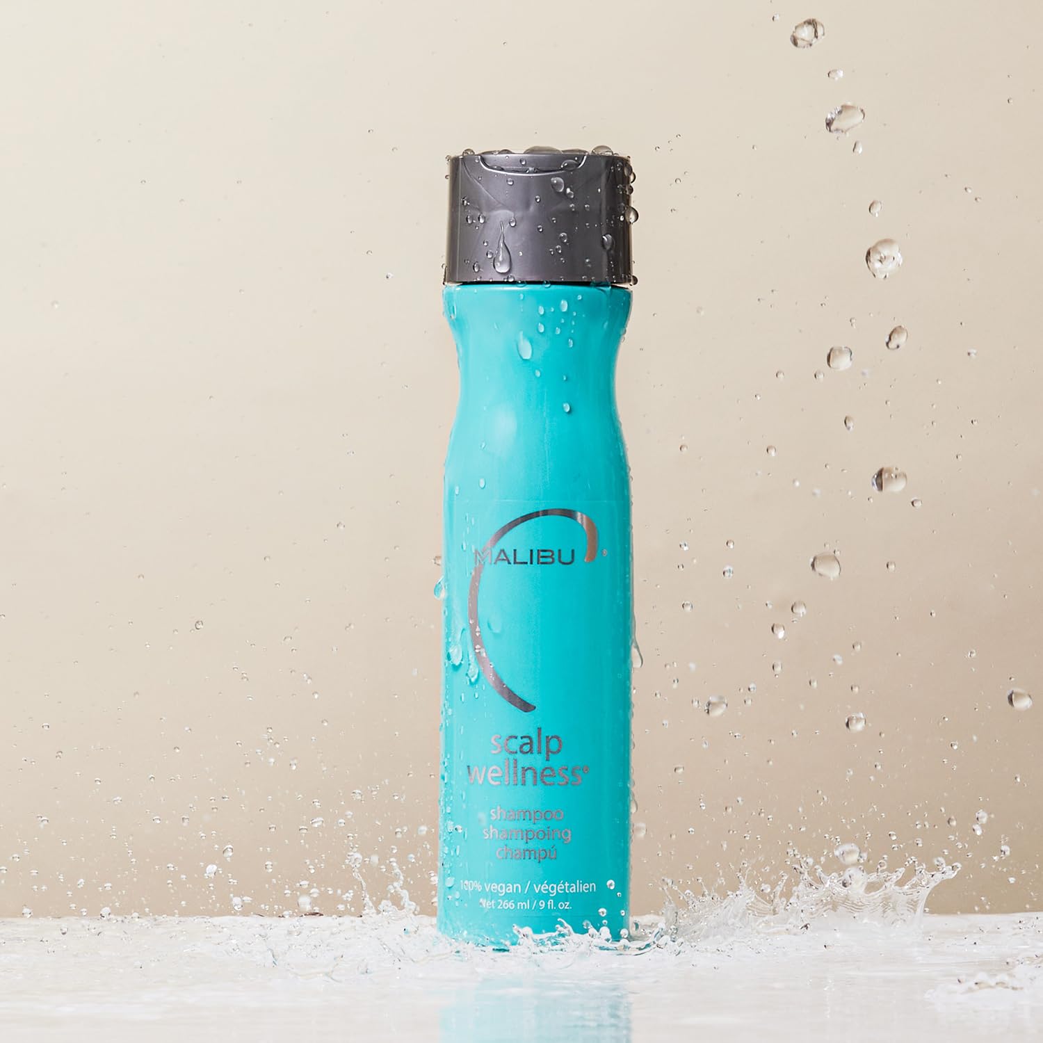 Malibu C Scalp Wellness Shampoo label closeup reveals vegan formula and minty ingredients.