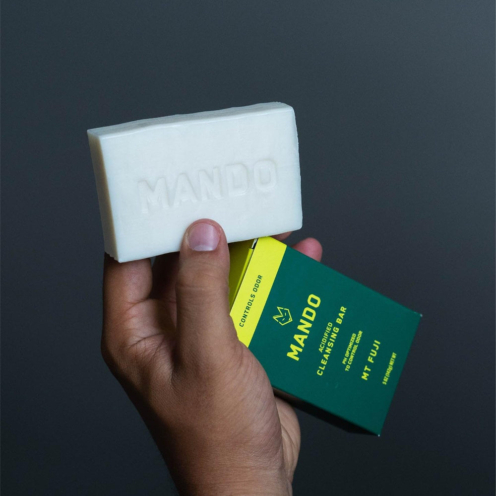 Shower-ready scene with Mando bar in hand for daily odor management.
