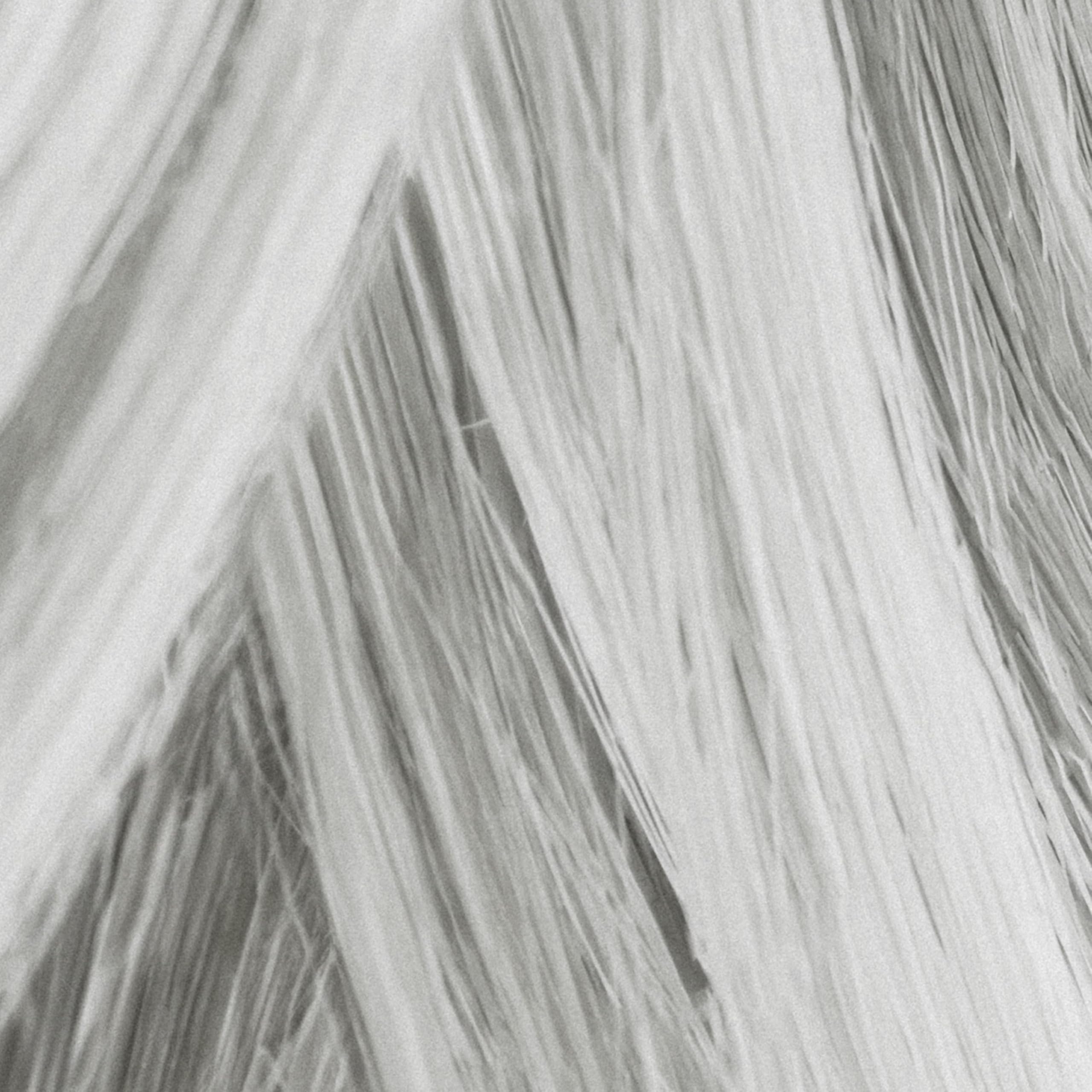 MANE Thickening fibers applied via brush for quick root coverage.