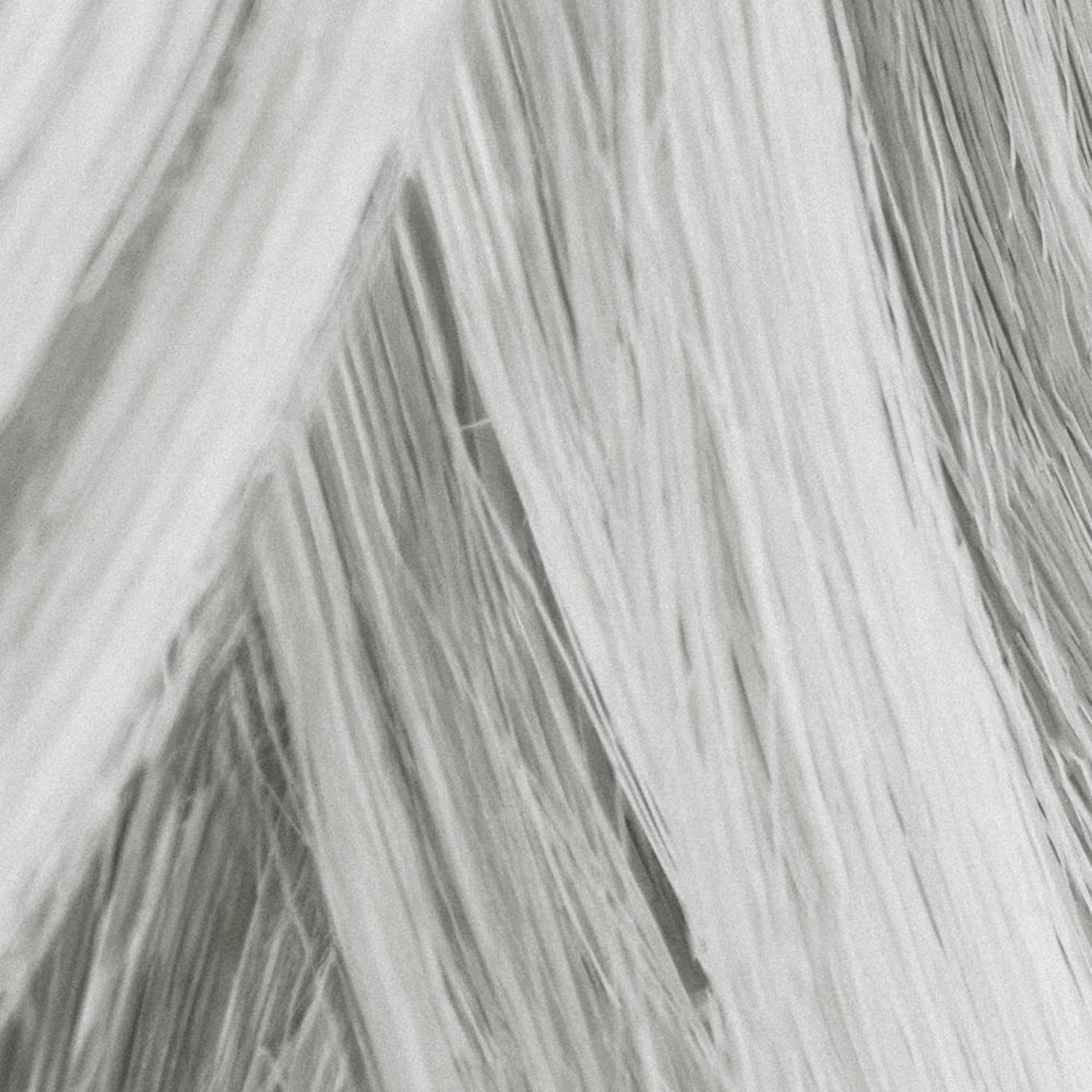 MANE Thickening fibers applied via brush for quick root coverage.