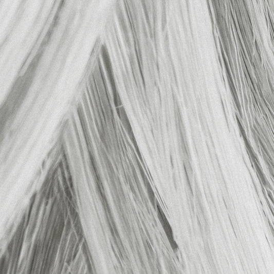 MANE Thickening fibers applied via brush for quick root coverage.