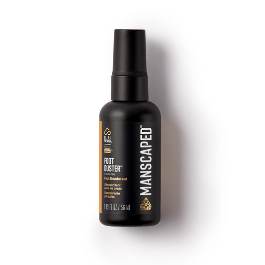 MANSCAPED Foot Duster bottle close-up highlighting cooling tea tree formula.