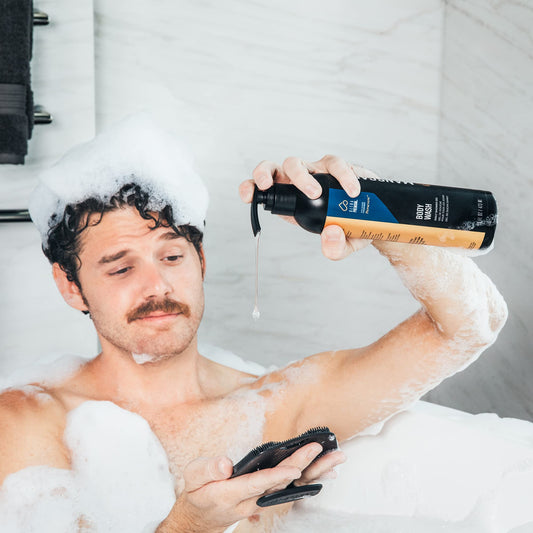 Hands lathering MANSCAPED Persevere for hydrating cleanse and comfortable skin.