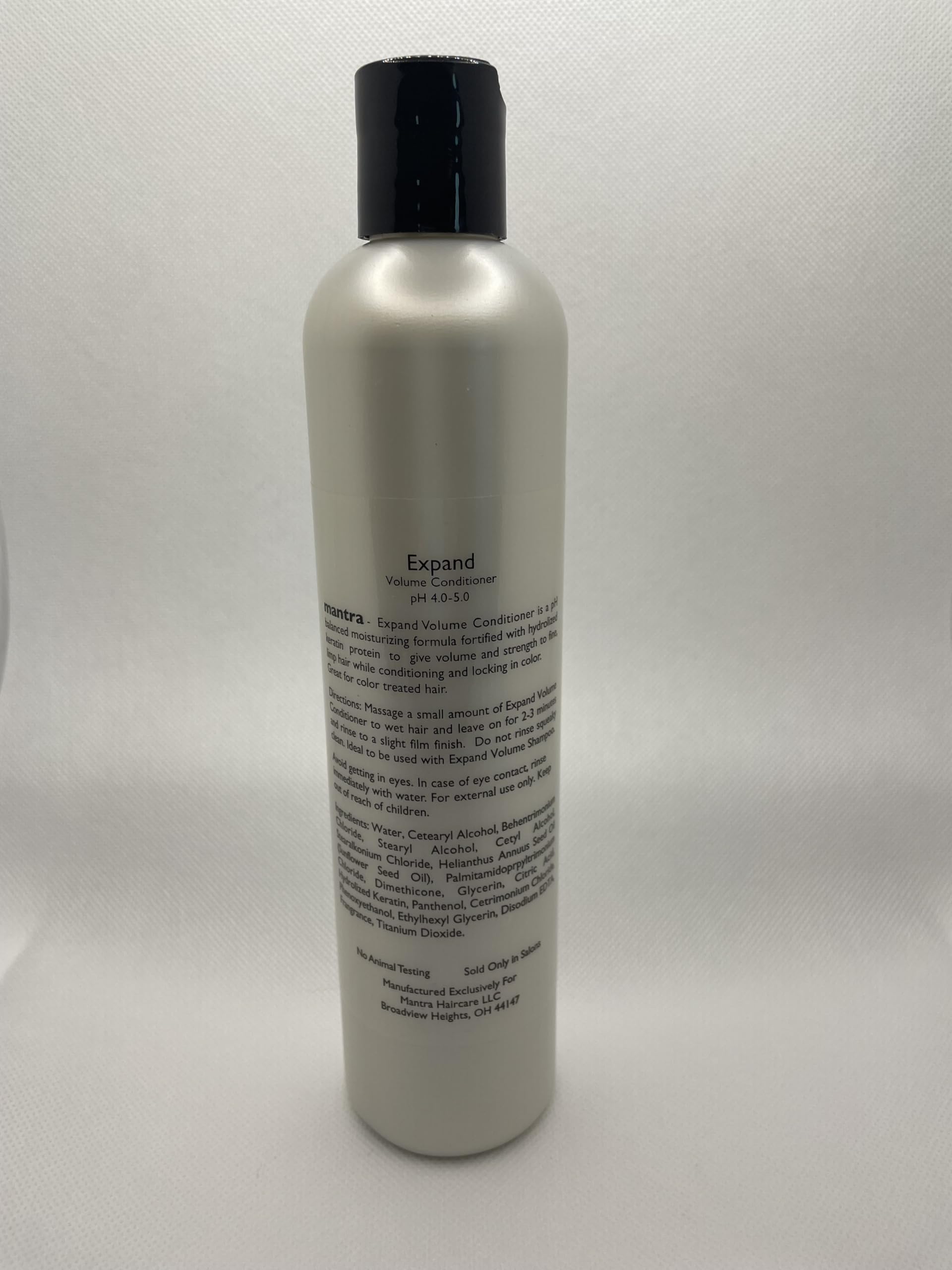 Applying Mantra Enlightenment Expand Volume Conditioner for voluminous, color safe hydration
