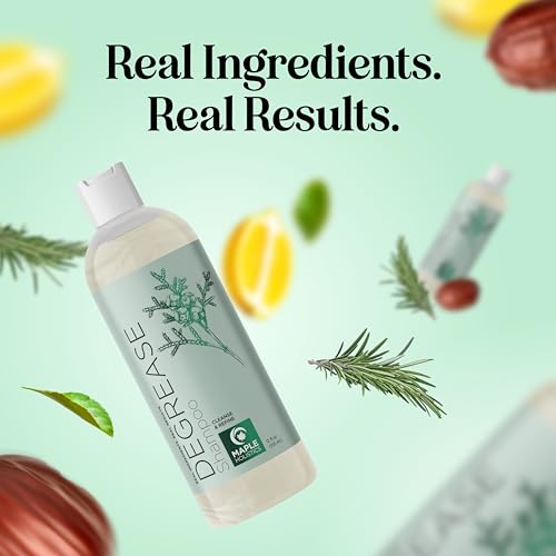 Shampoo bottle surrounded by rosemary and lemon slices signaling key ingredients