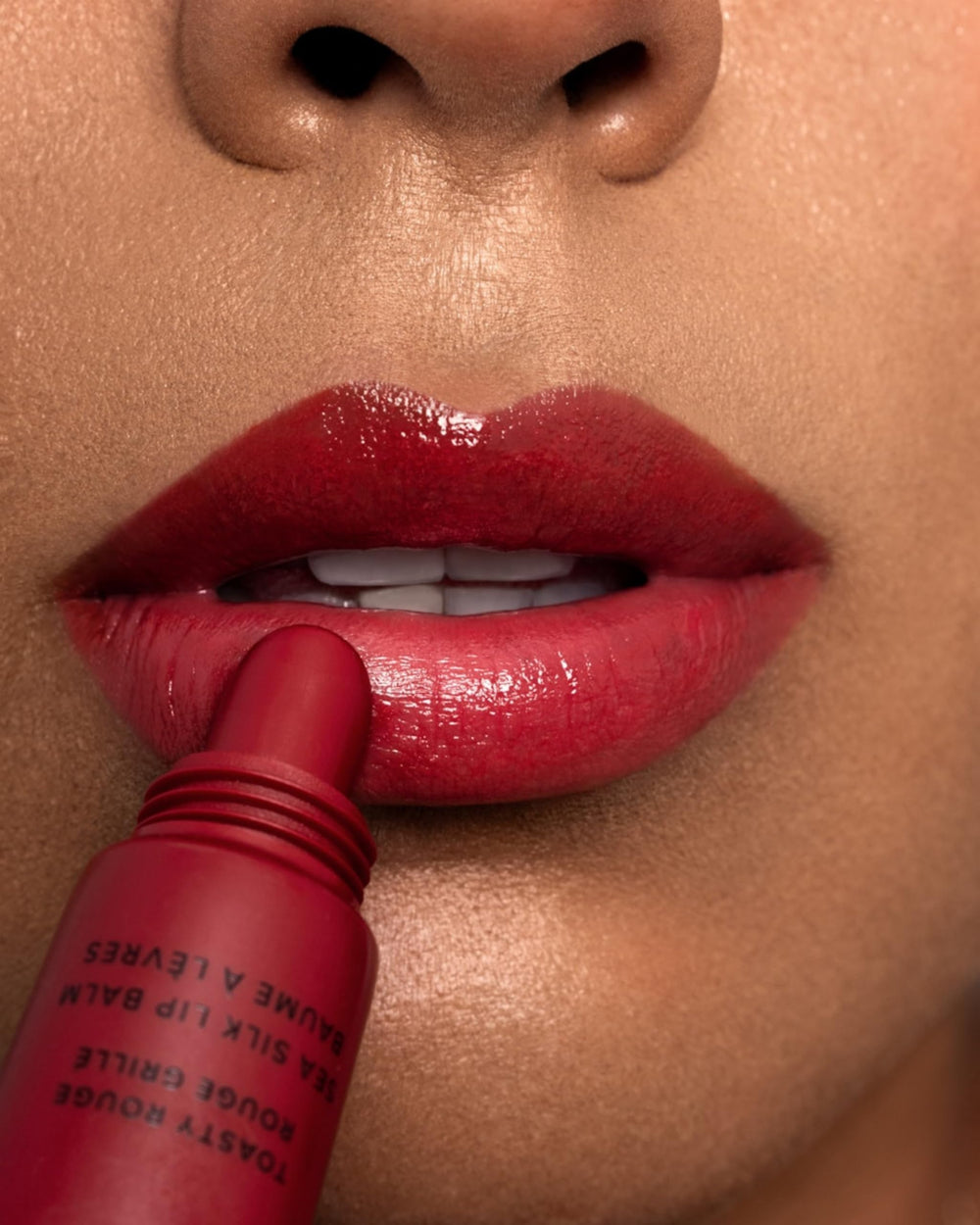 MARA Sea Silk Lip Balm Treatment warm red shade on lips