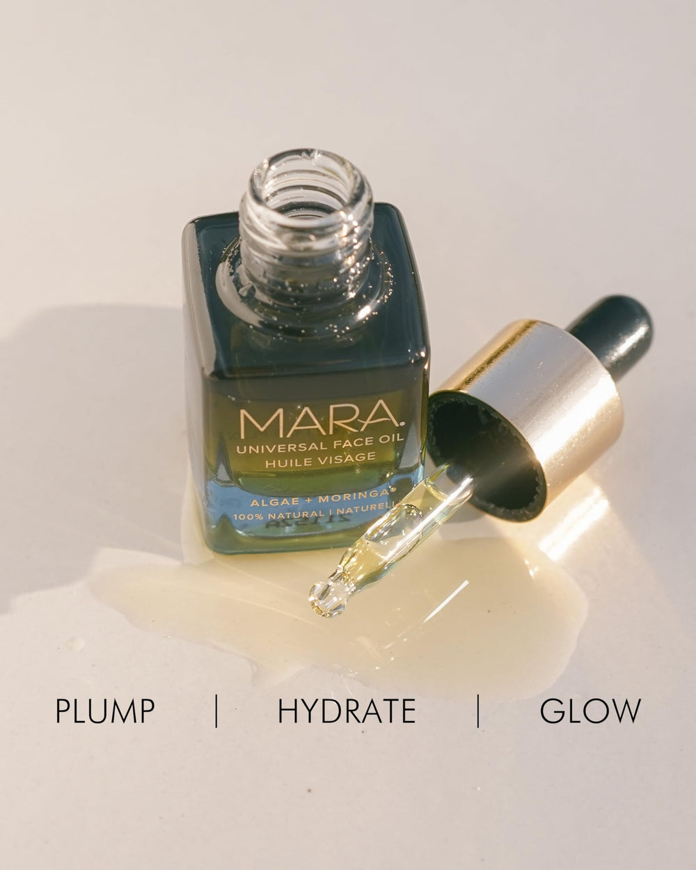 MARA Universal Hydrating Face Oil hands applying for smooth, hydrated skin