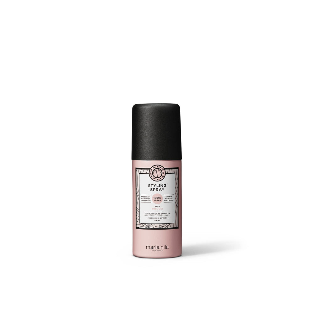 Maria Nila Styling Spray bottle close-up showing light hold and shine.