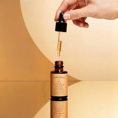 Marianella maracuya passion fruit oil bottle emphasizes vitamin C benefits.