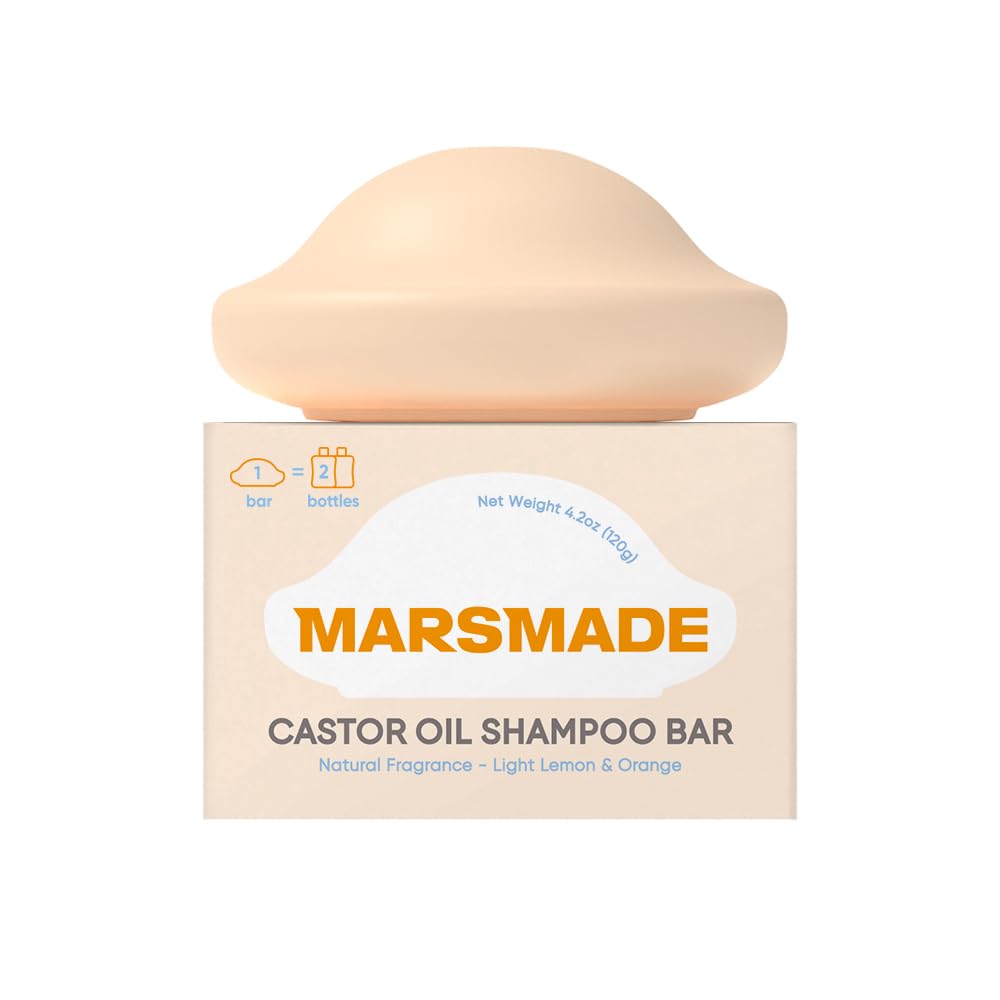 Mars Made Castor Oil Shampoo Bar packaging in focus, bottle-free design.