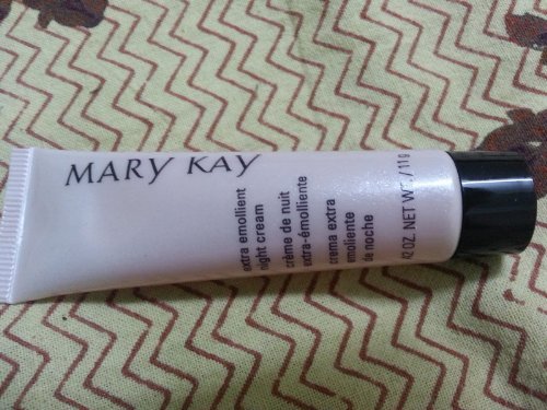 Mary Kay Extra Emollient Night Cream travel bottle for overnight hydration on the go.