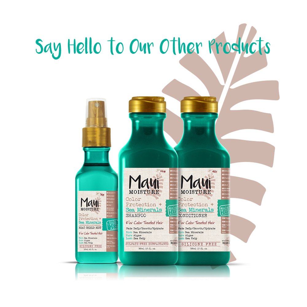 Maui Moisture Color Protect conditioner lather close-up on hair strands.