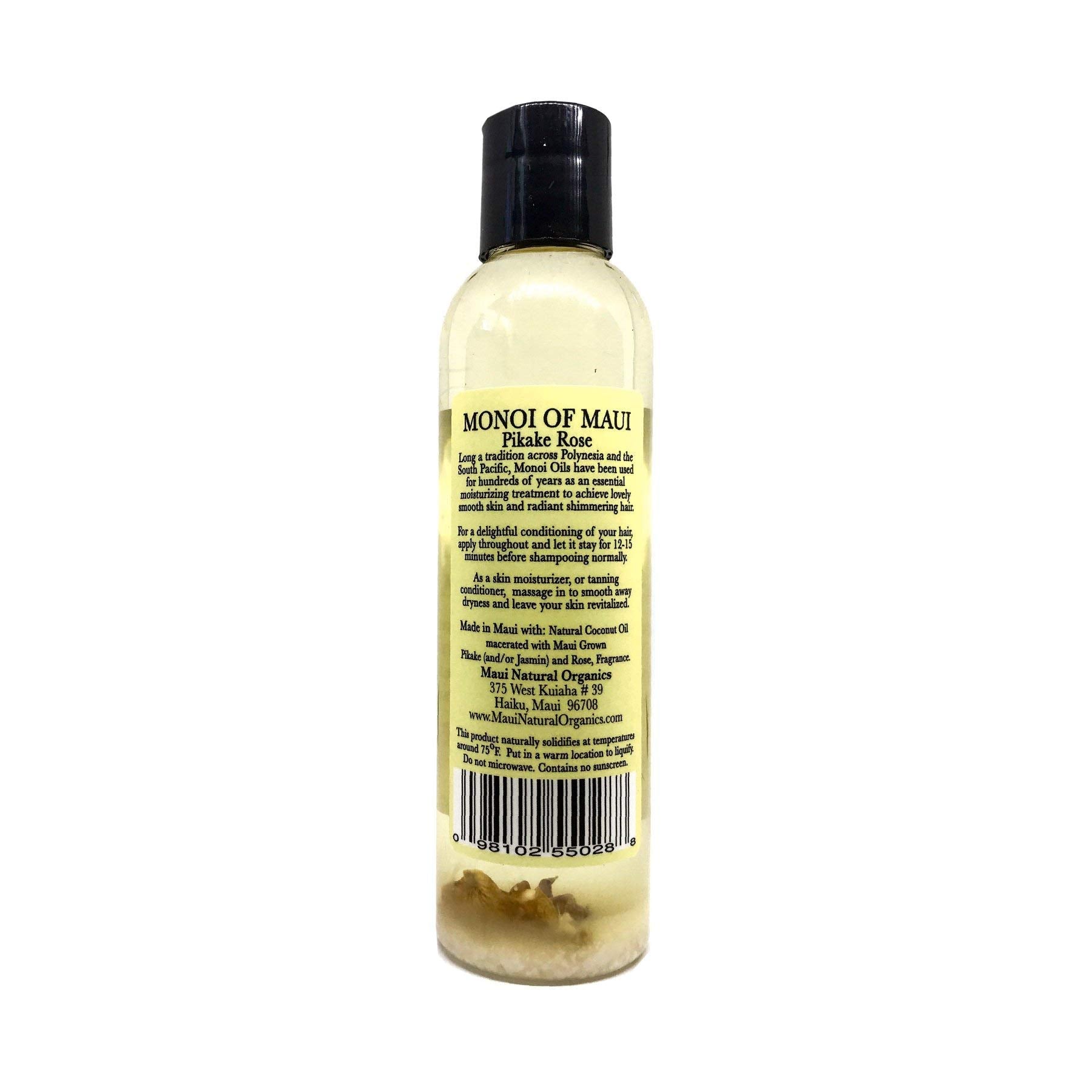 Maui Monoi Pikake Rose Oil being applied to hands for moisturized skin.