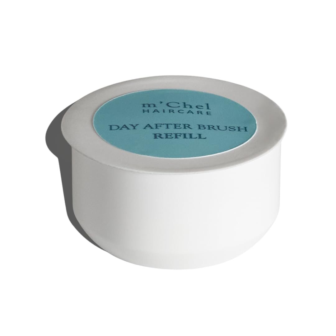 m'chel Day After Brush Dry Shampoo compact bottle showcases travel-friendly design for on-the-go refreshment.